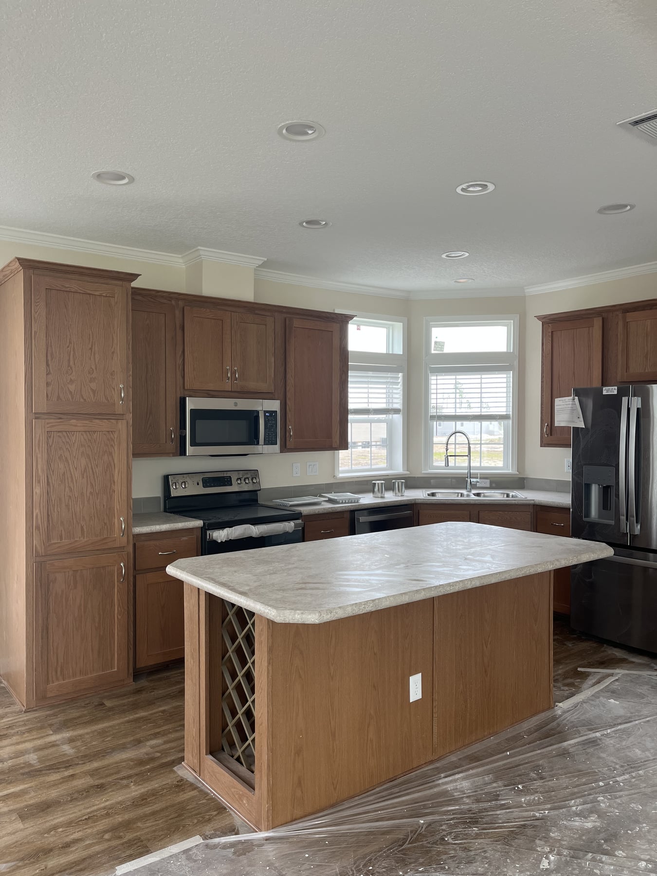 Wood-tone kitchen and island